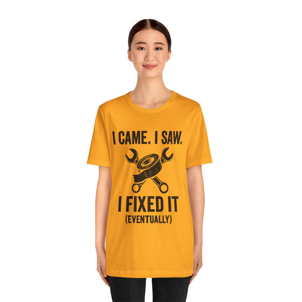 Orange crew-neck T-shirt with black repair-themed graphic and stacked text "I CAME, I SAW"