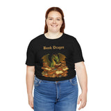 Black crewneck T-shirt on a plus-size model; “Book Dragon” text and dragon books print
