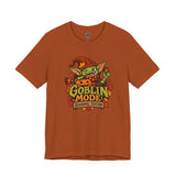 Rust brown crew-neck graphic t-shirt with goblin mascot and colorful 'Goblin Mode' print
