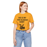 Orange crewneck T-shirt with snow-blowing graphic and stacked lettering on chest