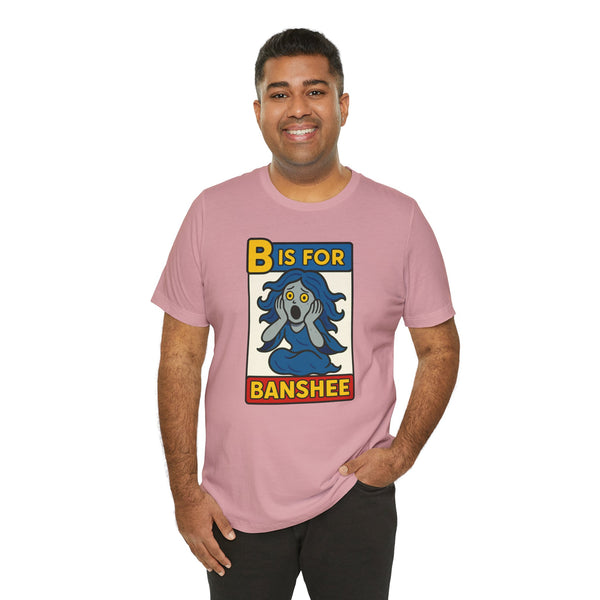 Pink t-shirt on model; front “B is for Banshee” alphabet legend graphic.