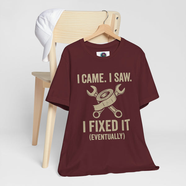 Maroon graphic T-shirt on hanger: “I came. I saw. I fixed it (eventually)” design