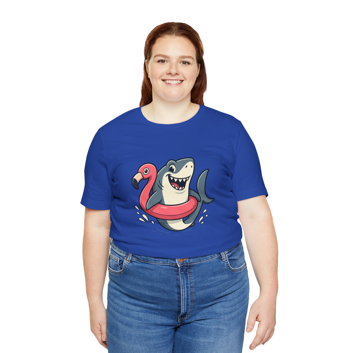 Royal blue t-shirt with smiling shark and flamingo float illustration