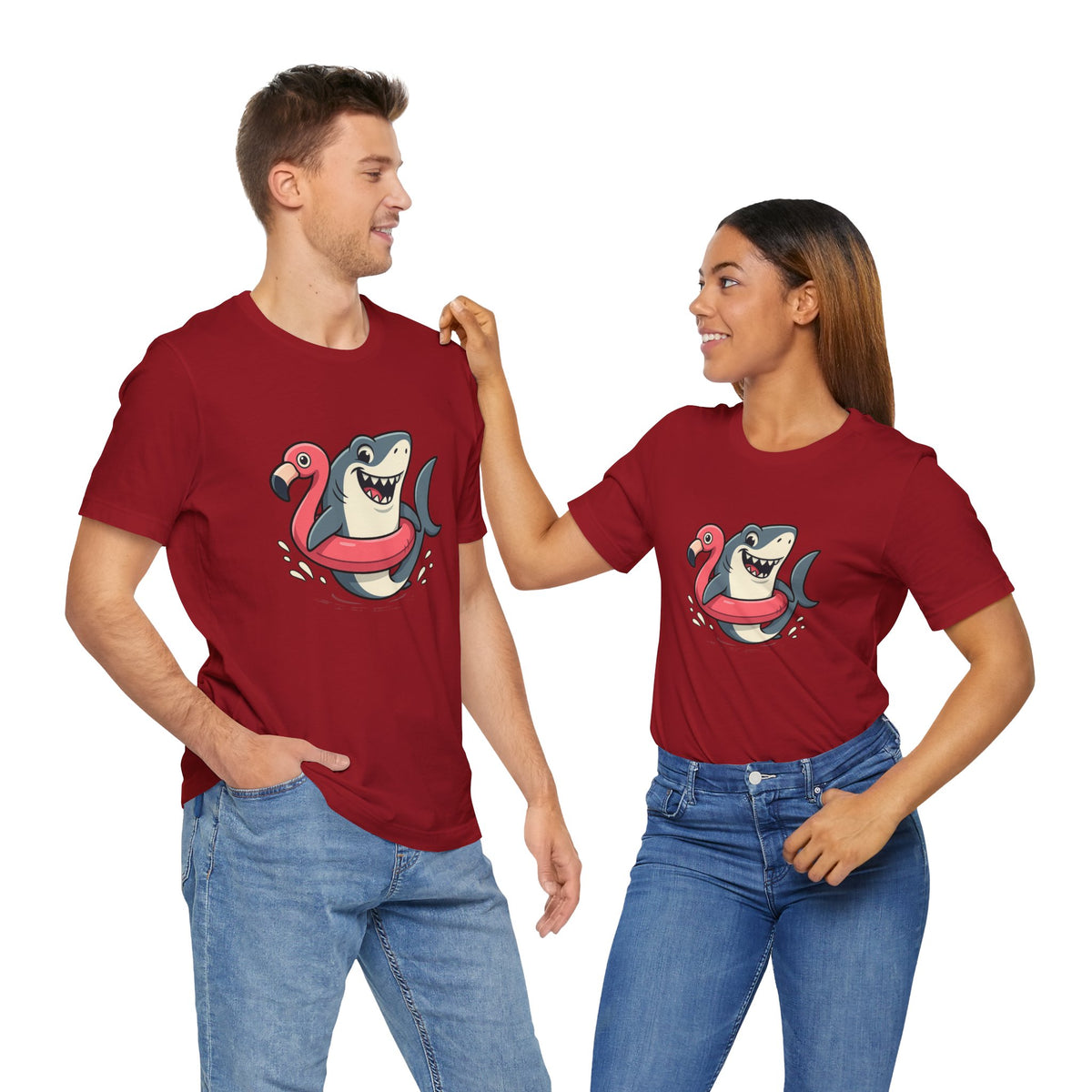 Two red T-shirts shown together, each with cartoon shark and flamingo front graphic