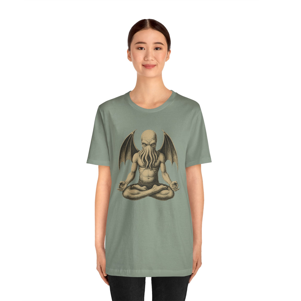 Green unisex T-shirt on model, meditating sea monster graphic