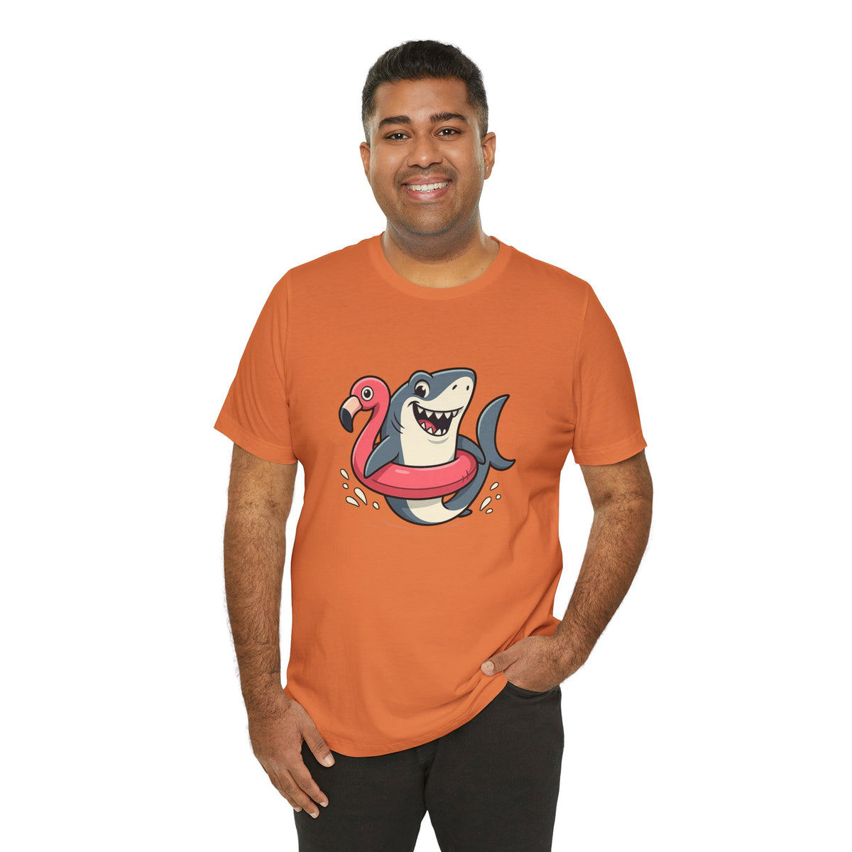 Orange crewneck T-shirt with shark and flamingo floatie graphic, model standing front.