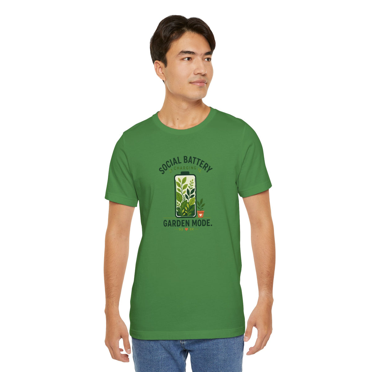 Green graphic T-shirt, “SOCIAL BATTERY” above “GARDEN MODE” with plant icon