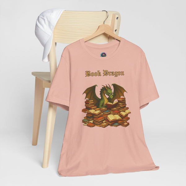 Pink crewneck t-shirt with dragon reading stacked books graphic