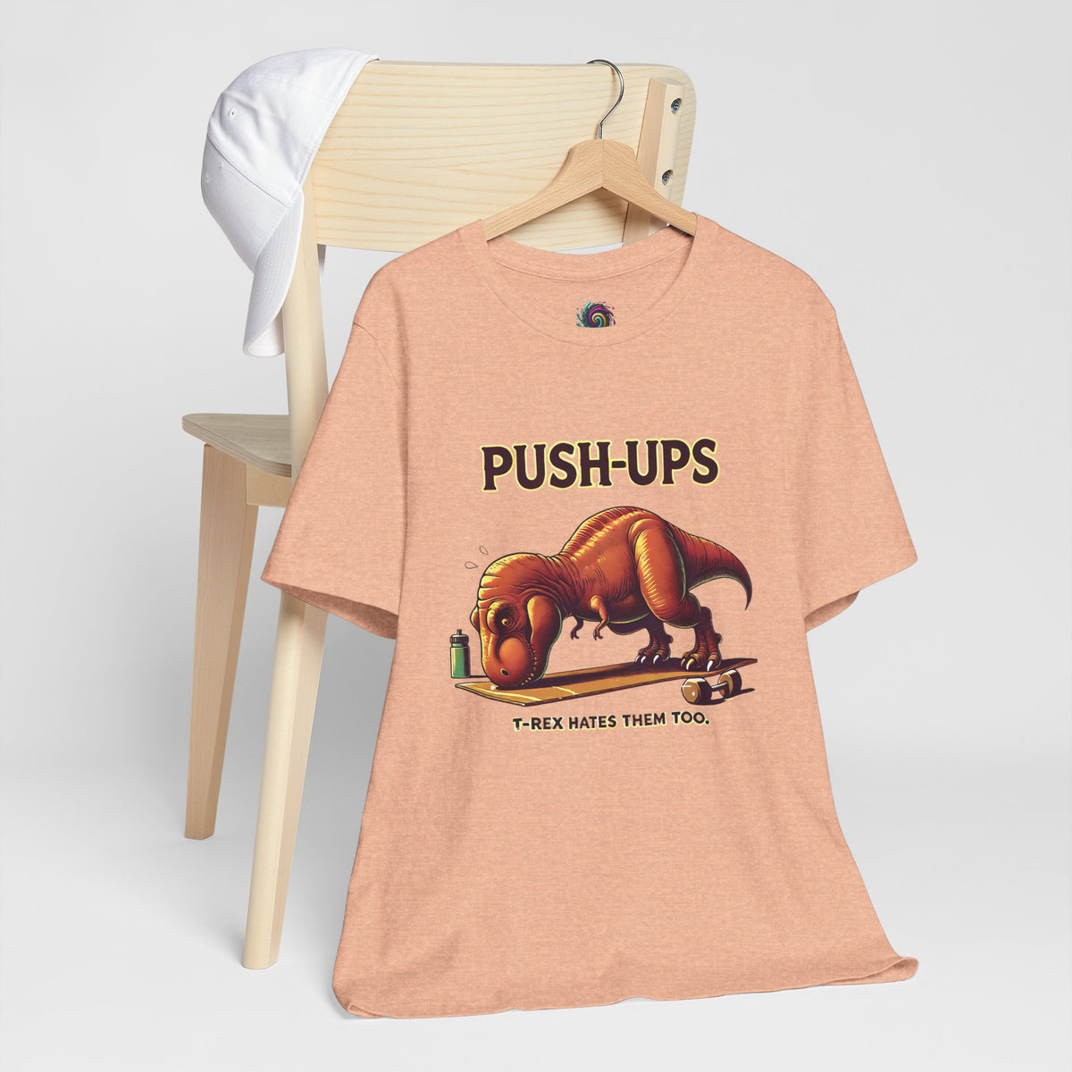 Heather peach graphic T-shirt with PUSH-UPS text and T-Rex push-up workout print