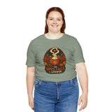 Sage green crewneck T-shirt with centered front graphic and short sleeves.