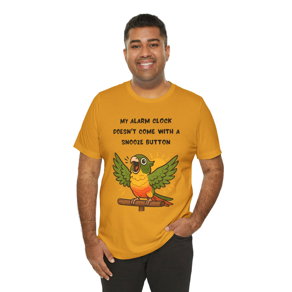Mustard t-shirt showing a cartoon parrot with wings and alarm clock text.