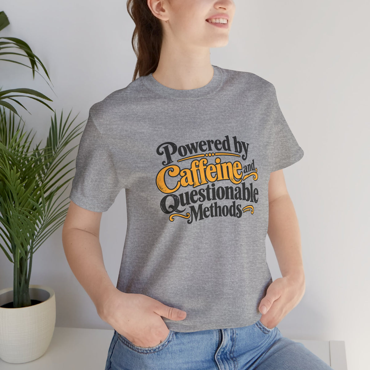 Heather gray crew-neck T-shirt with 'Powered by Caffeine and Questionable Methods' print