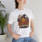 White t-shirt worn casually, featuring witch hat pumpkin graphic on the chest