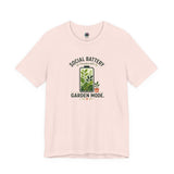Soft pink T-shirt with 'Social Battery Charging' and 'Garden Mode' plant graphic