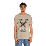 Beige short-sleeve T-shirt with repair-themed tools graphic and “eventually” phrase
