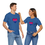 Royal blue T-shirts with centered bisexual pride heart graphic, worn by two people