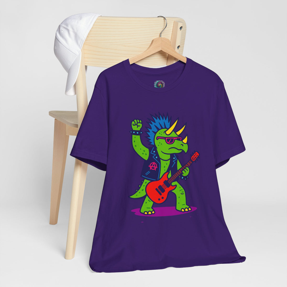 Purple crewneck graphic t-shirt with triceratops playing guitar, shown on hanger
