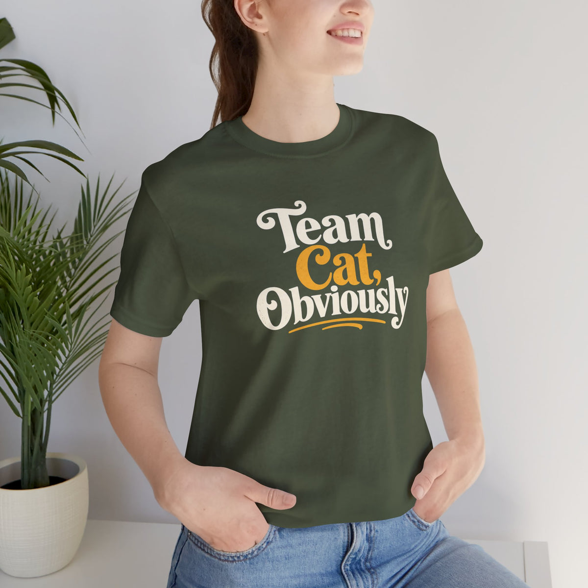 Military green crew-neck T-shirt with “Team Cat, Obviously” front print, angled view