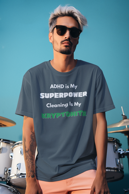 ADHD Cleaning Kryptonite T-Shirt – Funny Shirt for Neurodivergent Humor in deep teal worn by man with sunglasses against teal wall