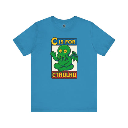 C is for Cthulhu T-Shirt – Lovecraftian Funny Cartoon Tee in aqua, flat lay style with bold Cthulhu cartoon illustration.