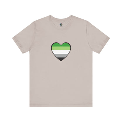 Aromantic Flag Heart T-Shirt – Laid flat in heather cool grey. Features a centered aromantic heart symbol in LGBTQIA+ colors. Keywords: aromantic flag heart, aromantic pride merch, aromantic shirt.