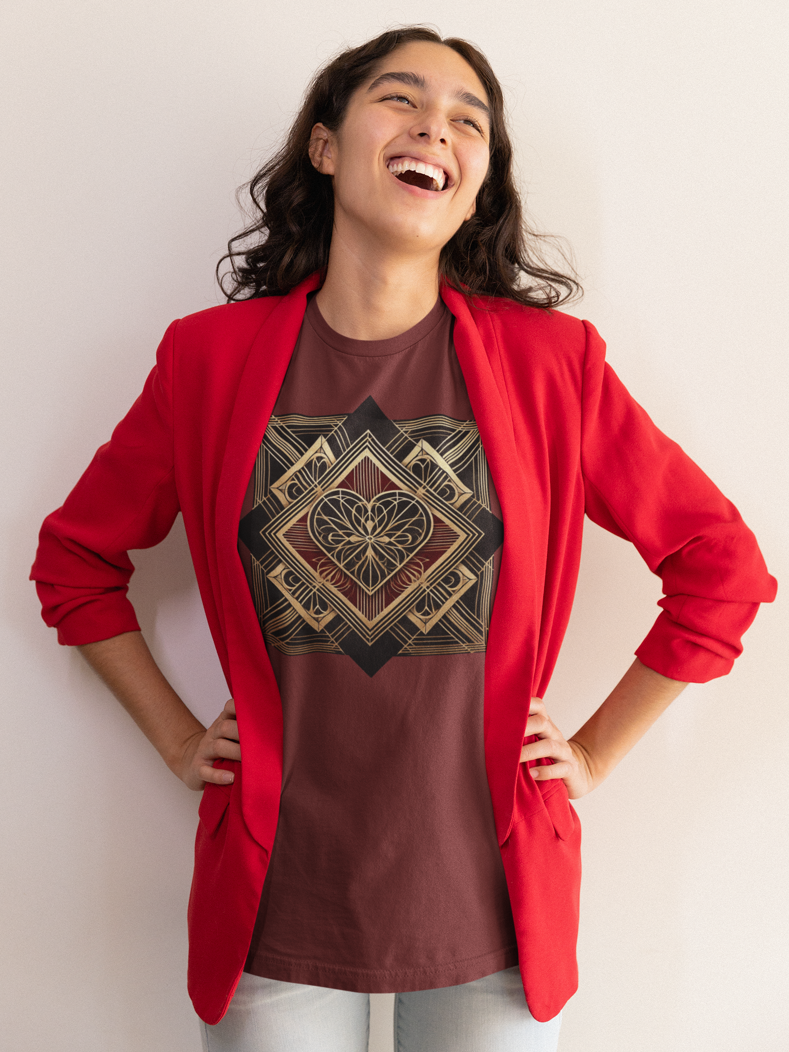 Art Deco Heart T-Shirt – Romantic Valentine’s Day Graphic Tee shown worn by a woman laughing with hands on hips, featuring an elegant gold art deco heart design on a cardinal red shirt styled for a modern romantic look.