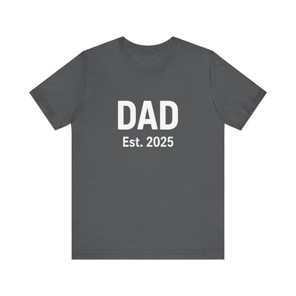 Dad Est. 2025 T-Shirt – New Dad Shirt, First Father’s Day Gift, Pregnancy Announcement Tee in asphalt grey flat lay on neutral background
