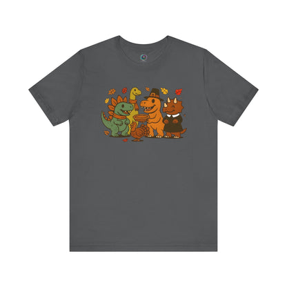 Thanksgiving Dinosaur T-Shirt – Funny Dino Thanksgiving Tee in asphalt gray with colorful cartoon dinosaurs sharing a festive meal surrounded by autumn leaves.