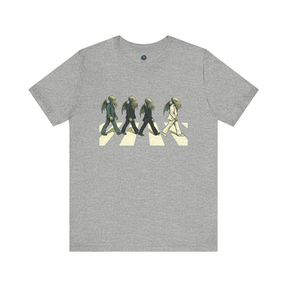 Cthulhu Crossing T-Shirt – Beatles Abbey Road Parody Tee in athletic heather, flat lay featuring lineup of Cthulhu rocker parody walkers.