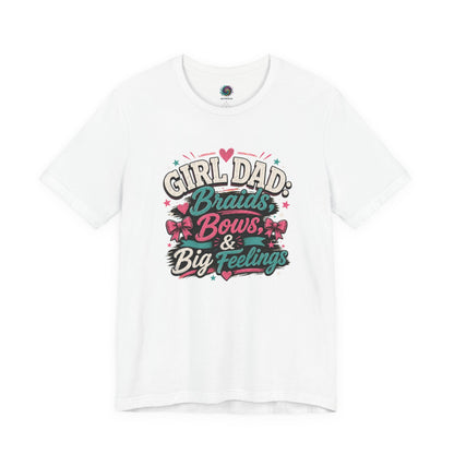 Girl Dad T-Shirt – Braids, Bows & Big Feelings Dad Tee shown on a white shirt with playful pink and teal lettering for a sweet Father’s Day gift.
