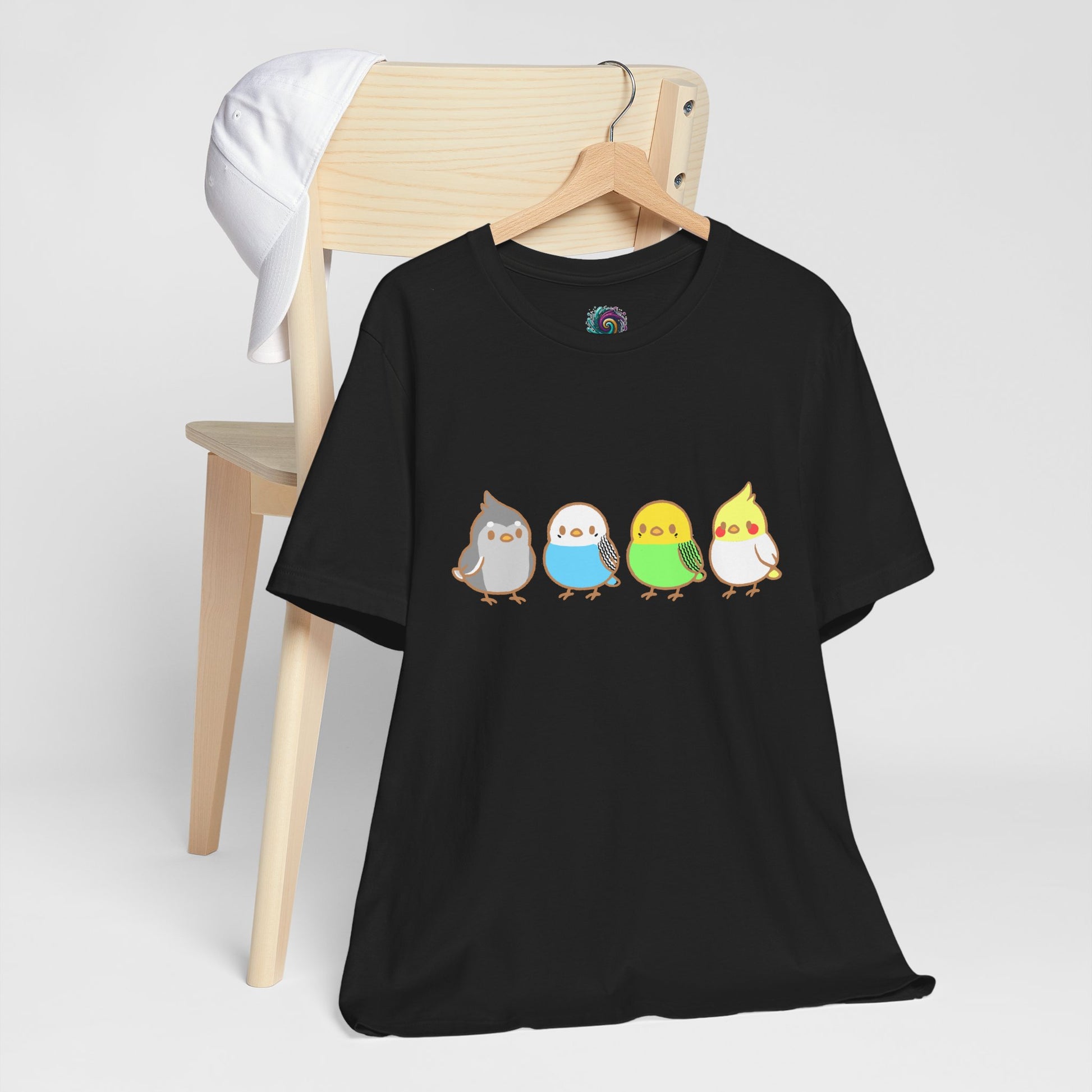 Black Chirpy Flock Bird T-Shirt from WhimSpin 4 chibi cartoon pet birds lined up in a row. 