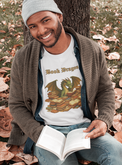 Book Dragon T-Shirt – Funny Book Lover Shirt featuring a smiling man in a gray beanie and cardigan reading under a tree in autumn