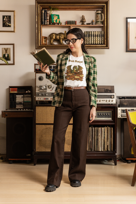 Book Dragon T-Shirt – Funny Book Lover Shirt featuring a woman in a retro green plaid blazer reading a vintage book in a cozy, book-filled room