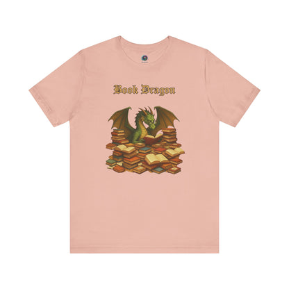 Book Dragon T-Shirt – Funny Book Lover Shirt on peach, featuring a dragon curled around piles of literature