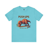 T-Rex Push-Up T-Shirt – Funny Dinosaur Workout Graphic Tee in turquoise with a cartoon dinosaur struggling through push ups, perfect for t rex workout fans.