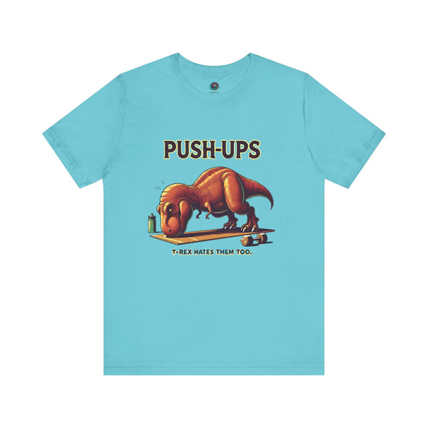 T-Rex Push-Up T-Shirt – Funny Dinosaur Workout Graphic Tee in turquoise with a cartoon dinosaur struggling through push ups, perfect for t rex workout fans.