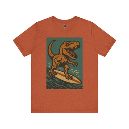 Burnt Orange Surfing t-rex t shirt  from WhimSpin- A rearing t Rex riding a yellow surf board on the waves
