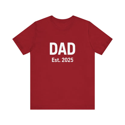 Dad Est. 2025 T-Shirt – New Dad Shirt, First Father’s Day Gift, Pregnancy Announcement Tee in canvas red flat lay with bold white lettering