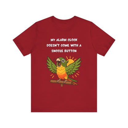 Parrot Alarm Clock T-Shirt – Funny Parrot Wake-Up Call Tee in Canvas Red, featuring the energetic cartoon parrot graphic with raised wings and the bold morning wake-up call text centered on the shirt.