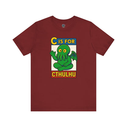 C is for Cthulhu T-Shirt – Lovecraftian Funny Cartoon Tee in cardinal, flat lay with Cthulhu cartoon artwork, funny mashup design.