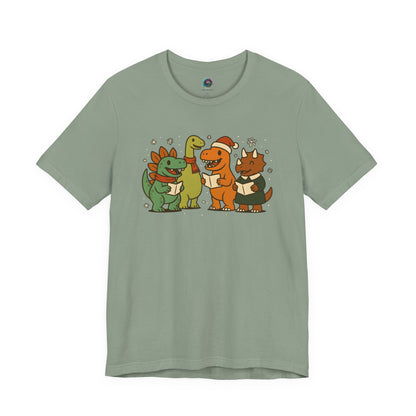 Dinosaur Carolers T-Shirt – Cute Dino Christmas Singing Tee in sage with holiday-themed dinosaurs and musical notes