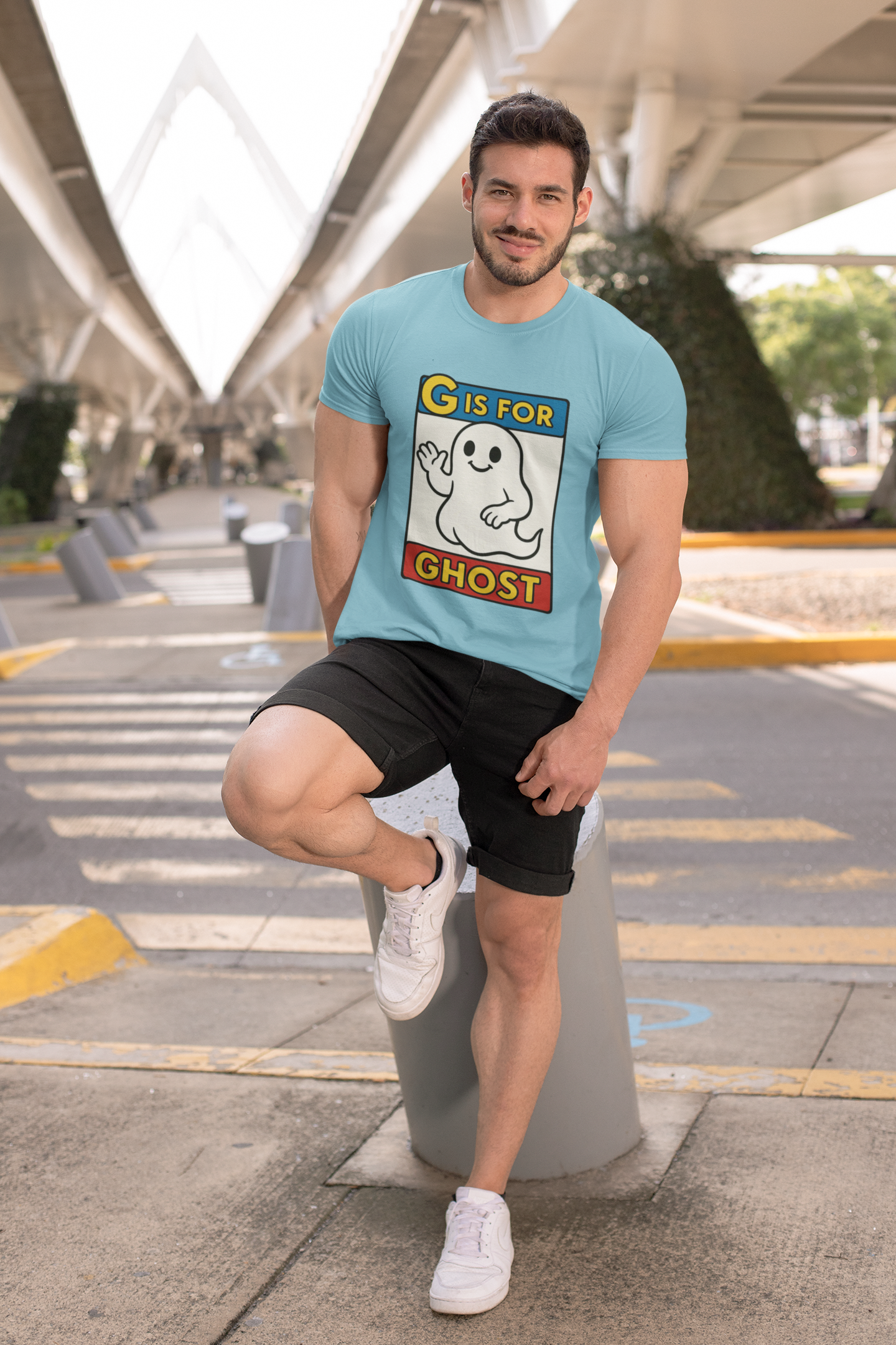 G is for Ghost T-Shirt – Funny Monster Alphabet Halloween Tee in turquoise, lifestyle photo of man wearing cartoon ghost alphabet shirt for spooky season.