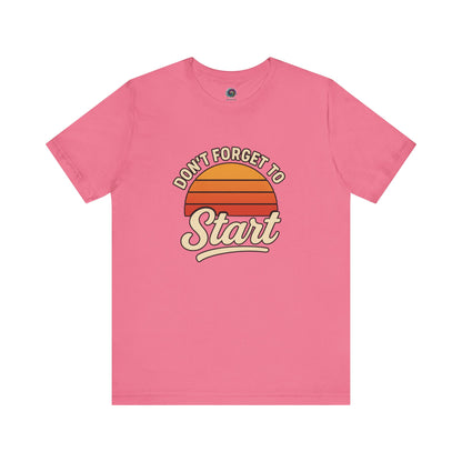 Don’t Forget to Start T-Shirt – Motivational Graphic Tee for Dreamers in Charity Pink with retro orange sun and script text