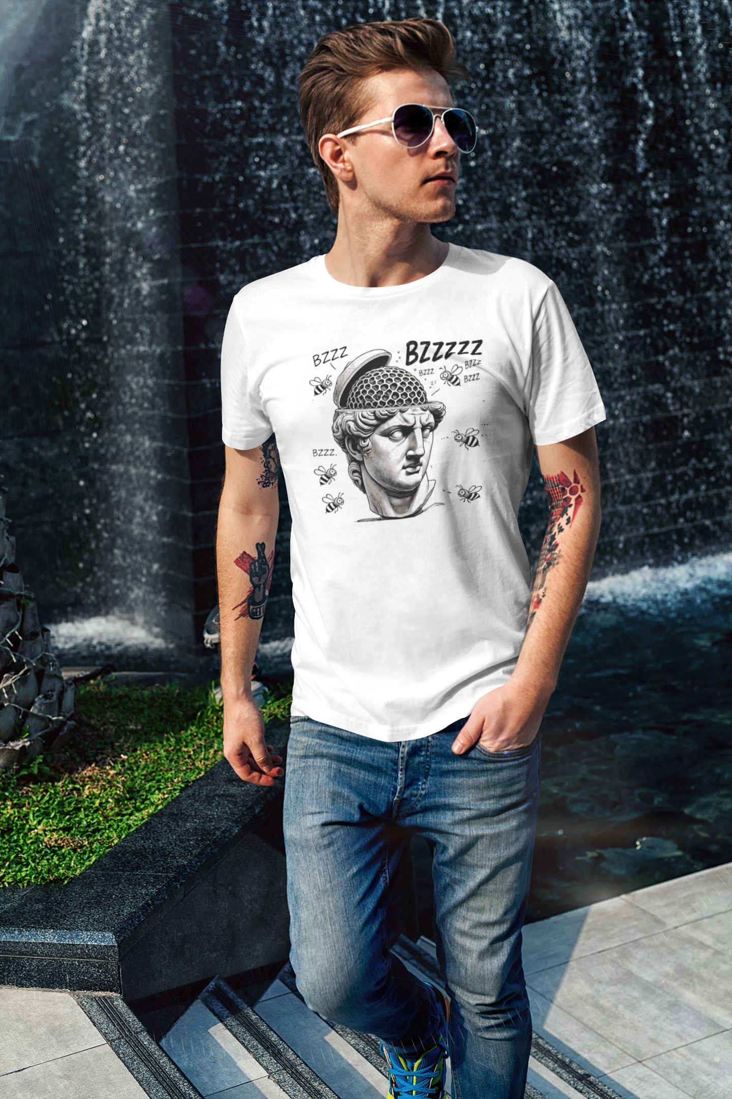 Hive Mind T-Shirt – Surreal Bee Group Think Parody Tee shown on man in white shirt by water feature