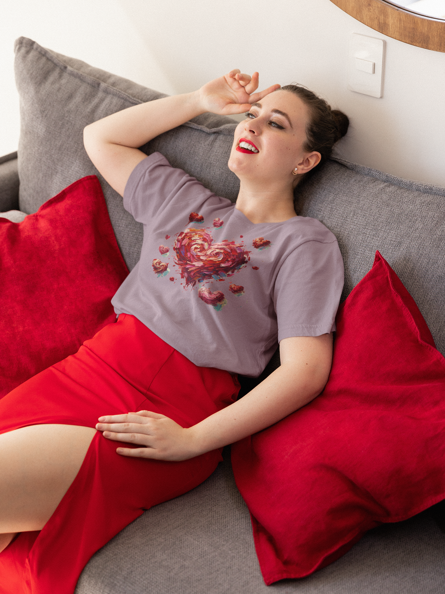Woman in red chair holding "You Wish" cookie wears Heather Purple Impressionistic Heart T-Shirt – Artistic Valentine's Day Tee