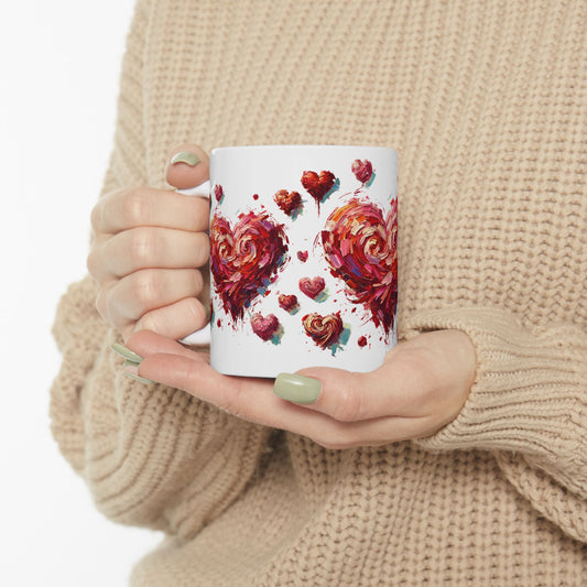 Impressionistic Heart Mug – Artistic Valentine's Day Coffee Cup 11oz & 15 oz held in hands against a soft neutral sweater, showcasing a painterly impressionistic heart design with expressive brushstrokes and romantic art-inspired style.