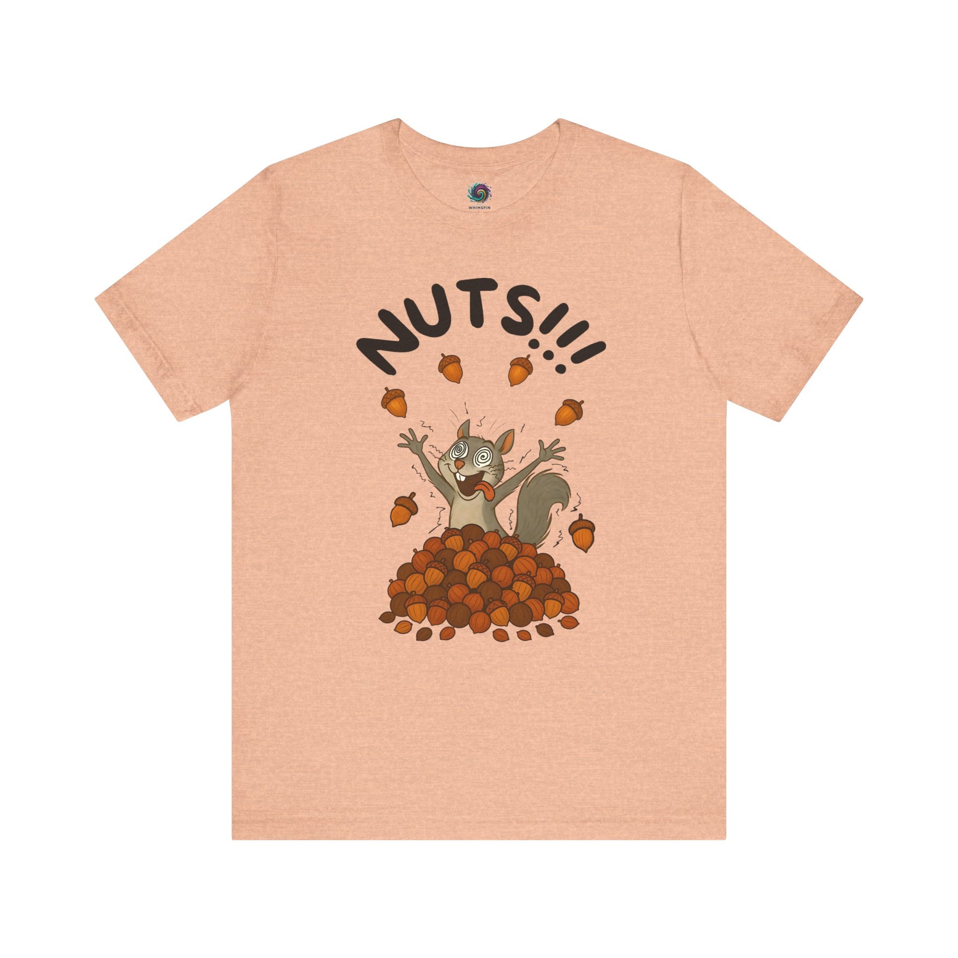 Crazy Squirrel Shirt – Funny Squirrel Nuts T-Shirt for Quirky Style laid flat in heather peach with fun squirrel character and scattered nuts