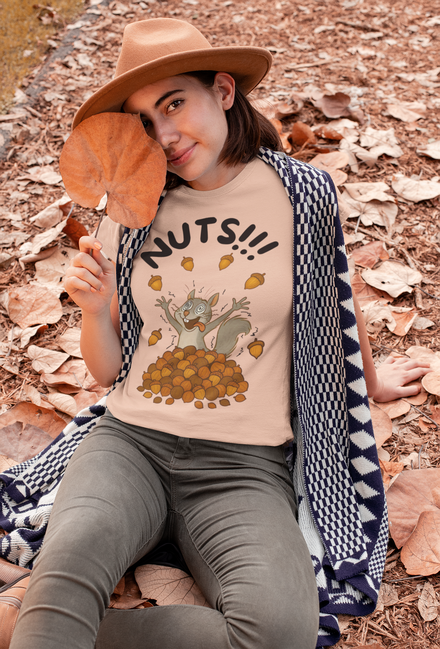 Crazy Squirrel Shirt – Funny Squirrel Nuts T-Shirt for Quirky Style in warm heather clay, worn casually by woman among fall foliage