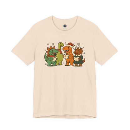 Dinosaur Carolers T-Shirt – Cute Dino Christmas Singing Tee in soft cream with dinosaurs singing and snowflake accents