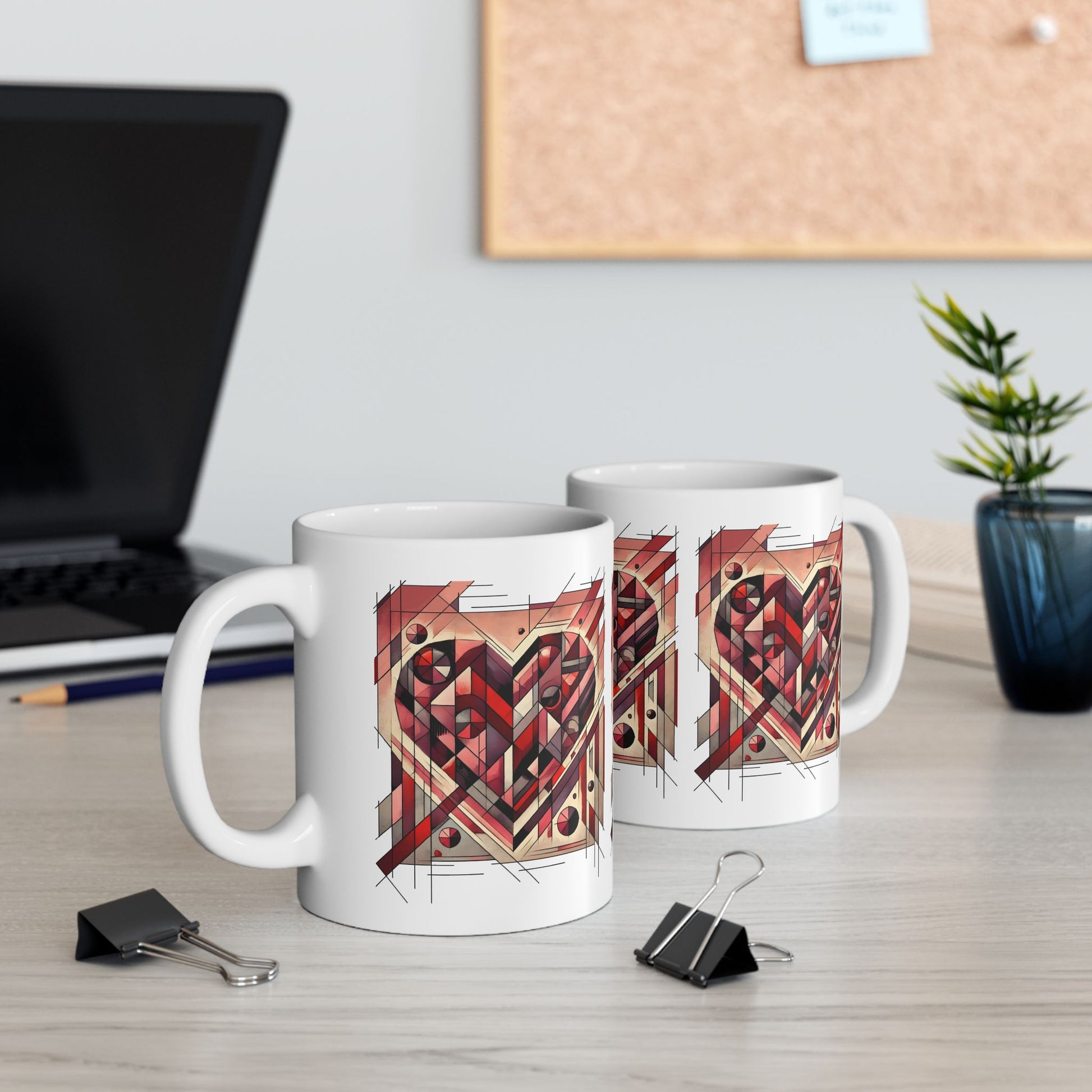 Cubist Heart Mug – Modern Art Valentine's Day Ceramic Coffee Cup (11oz/15oz) displayed on a work desk with laptop and stationery, showcasing a modern art heart mug perfect for creative spaces.